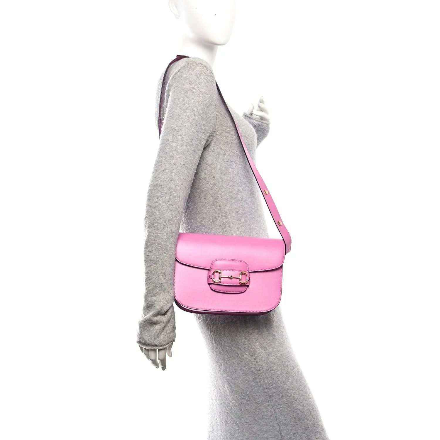 Gucci pink mini shoulder bag on model, gold horsebit clasp and adjustable strap