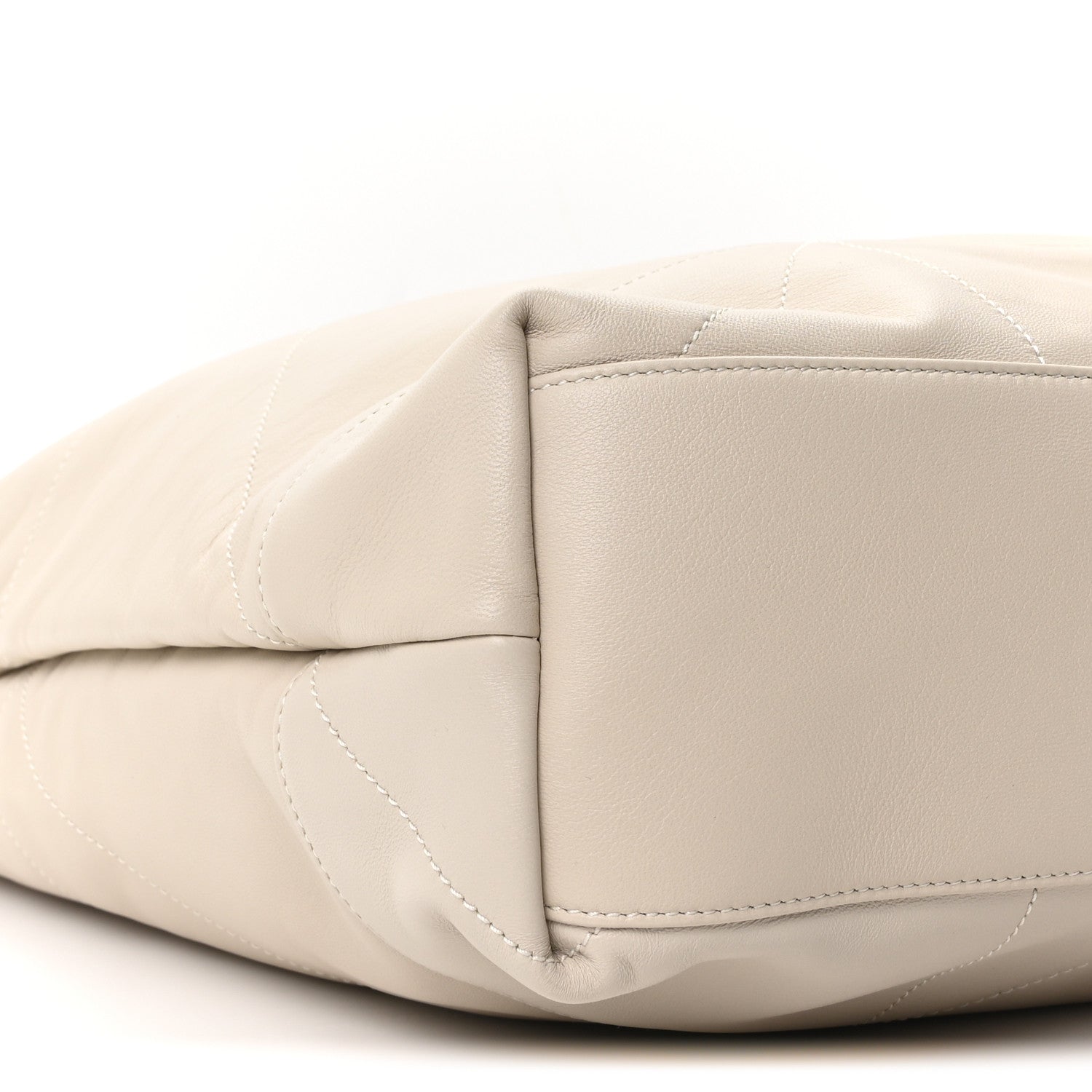 Cream lambskin tote bag corner with quilted stitching and curved base