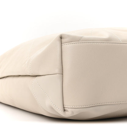 Cream lambskin tote bag corner with quilted stitching and curved base