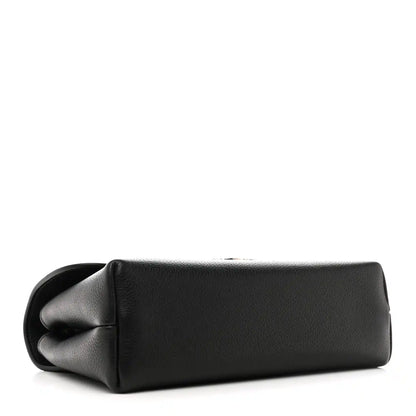 Black leather shoulder bag with rounded base and gathered flap detail
