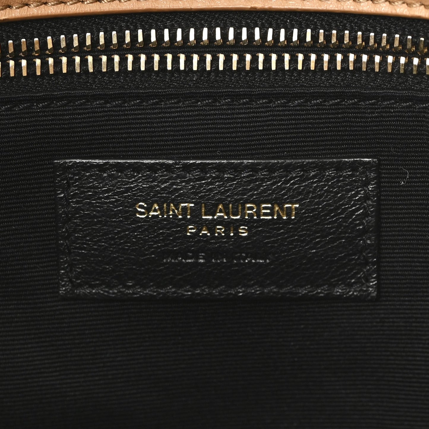SAINT LAURENT shearling bag label on black fabric lining under zipper