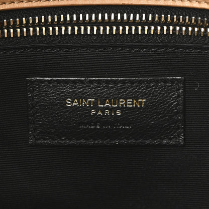 SAINT LAURENT shearling bag label on black fabric lining under zipper