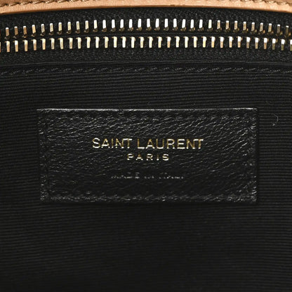 SAINT LAURENT shearling bag label on black fabric lining under zipper