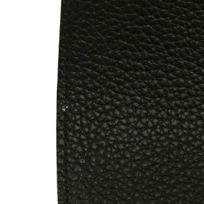 Black pebbled leather mini handbag texture close-up