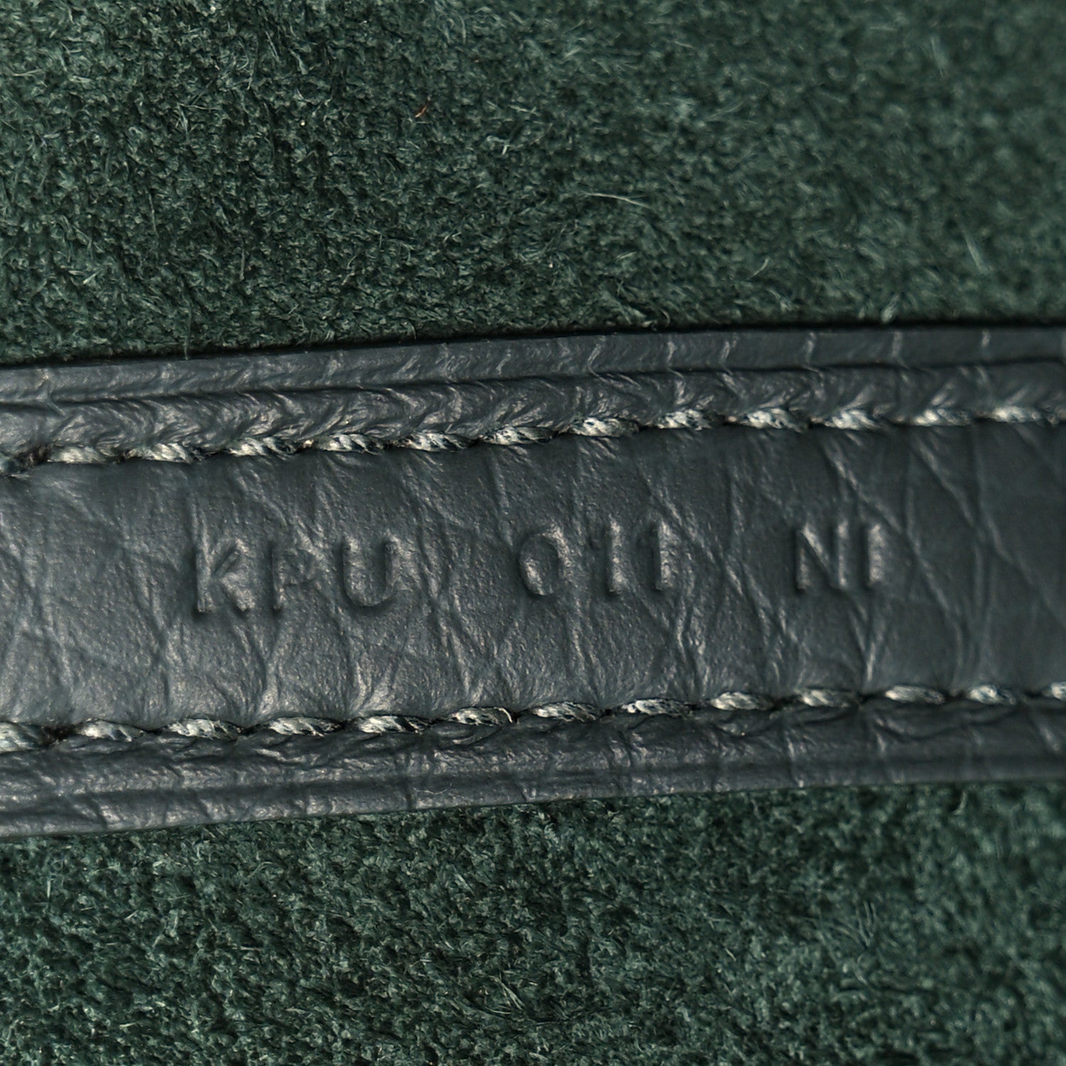 Dark green textured leather with braided trim and edge stitching detail