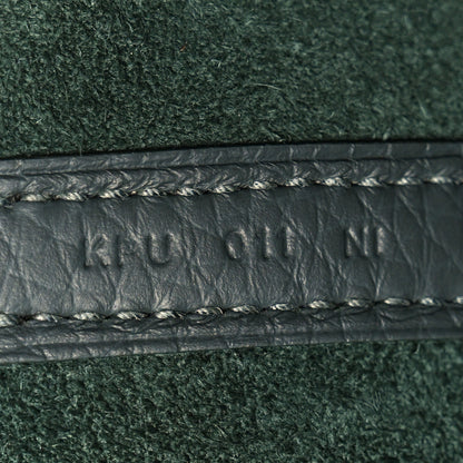 Dark green textured leather with braided trim and edge stitching detail