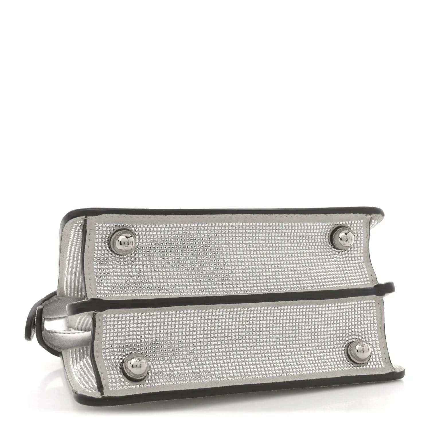 Silver crystal satchel front panel with snap buttons and leather strap