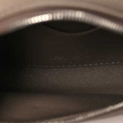 Leather interior lining with embossed logo and stitched trim