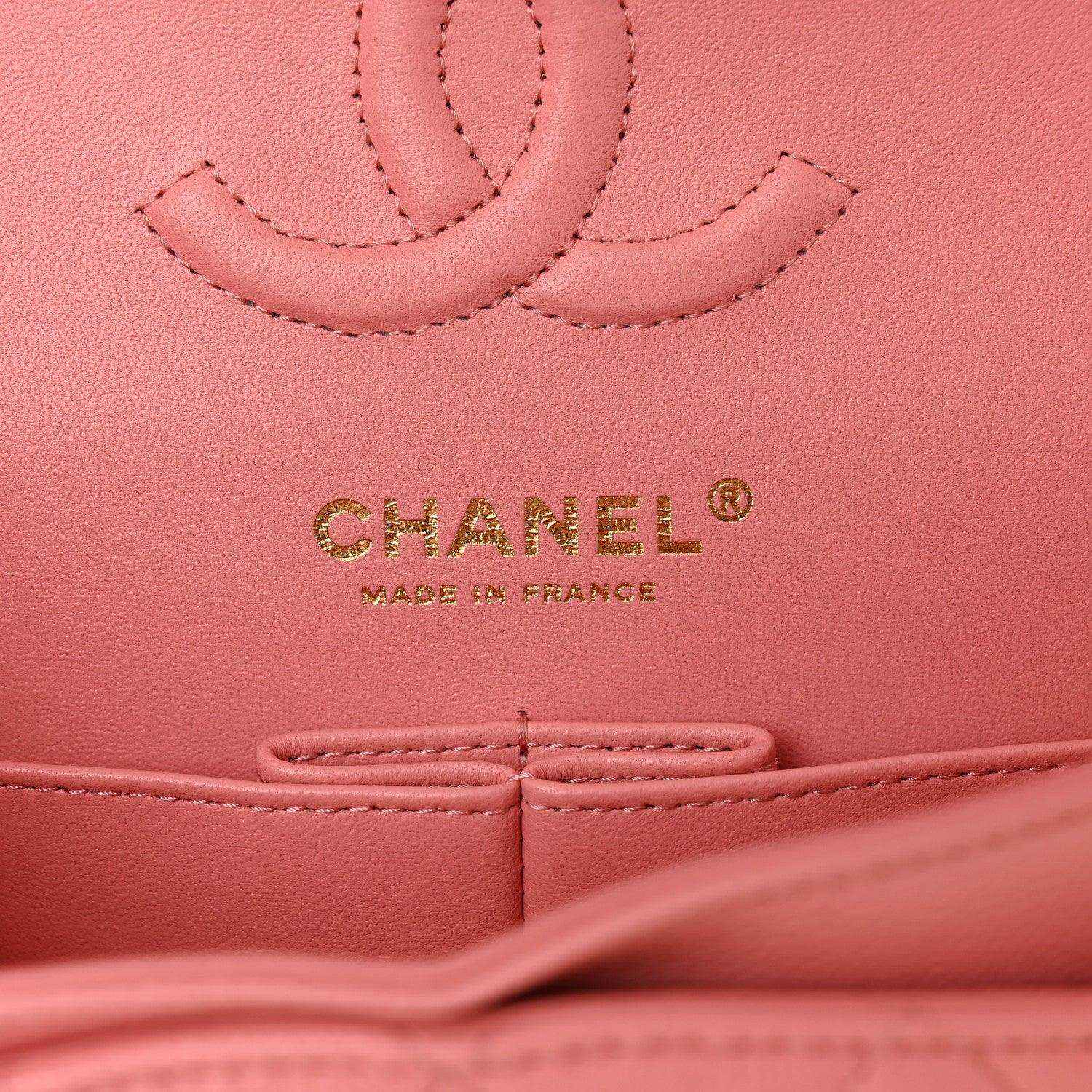 CHANEL logo and Made in France mark on light pink caviar-textured leather