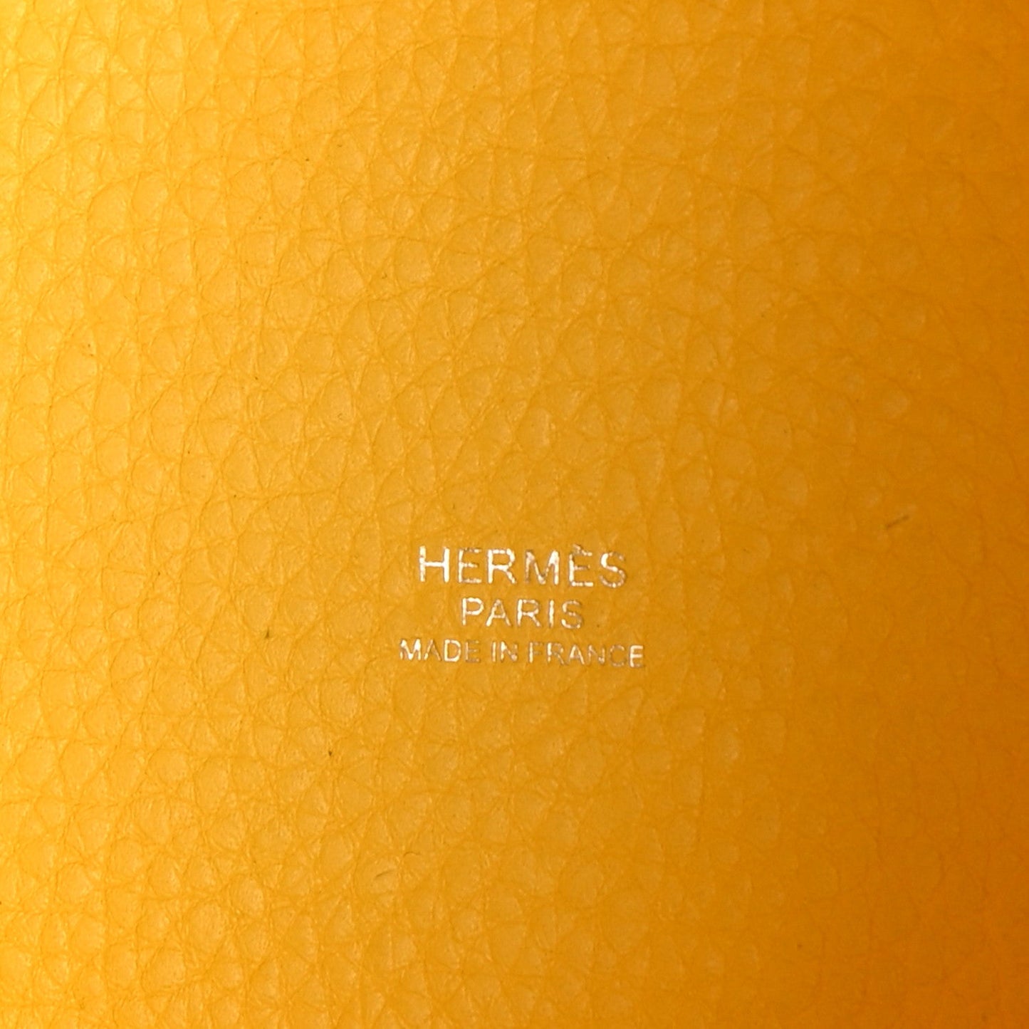 Lime yellow pebbled leather with Hermès Paris stamp in center