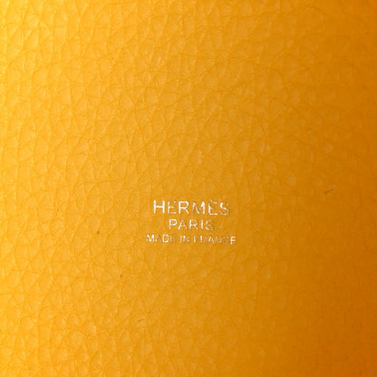 Lime yellow pebbled leather with Hermès Paris stamp in center