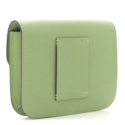Light green leather slim wallet with card slot pocket under flap
