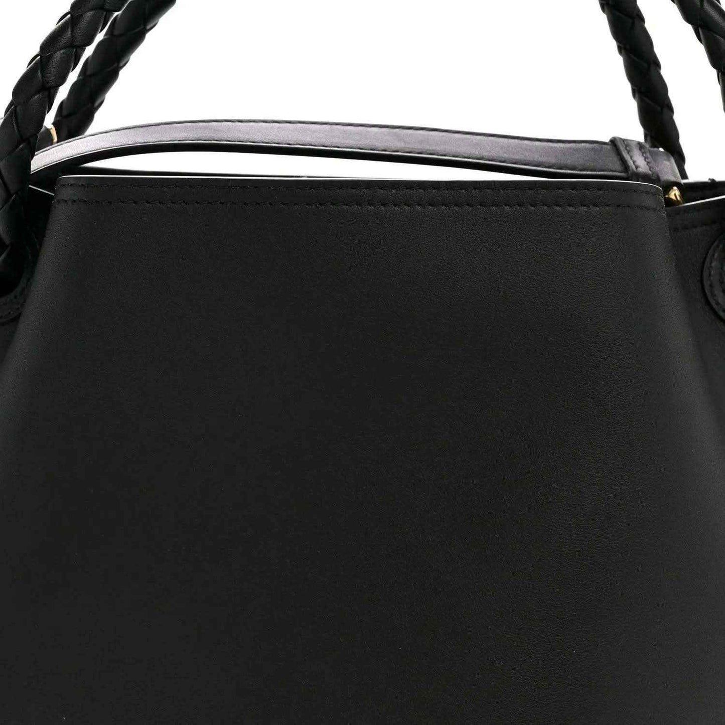 Black bucket bag top edge with braided handle and leather trim