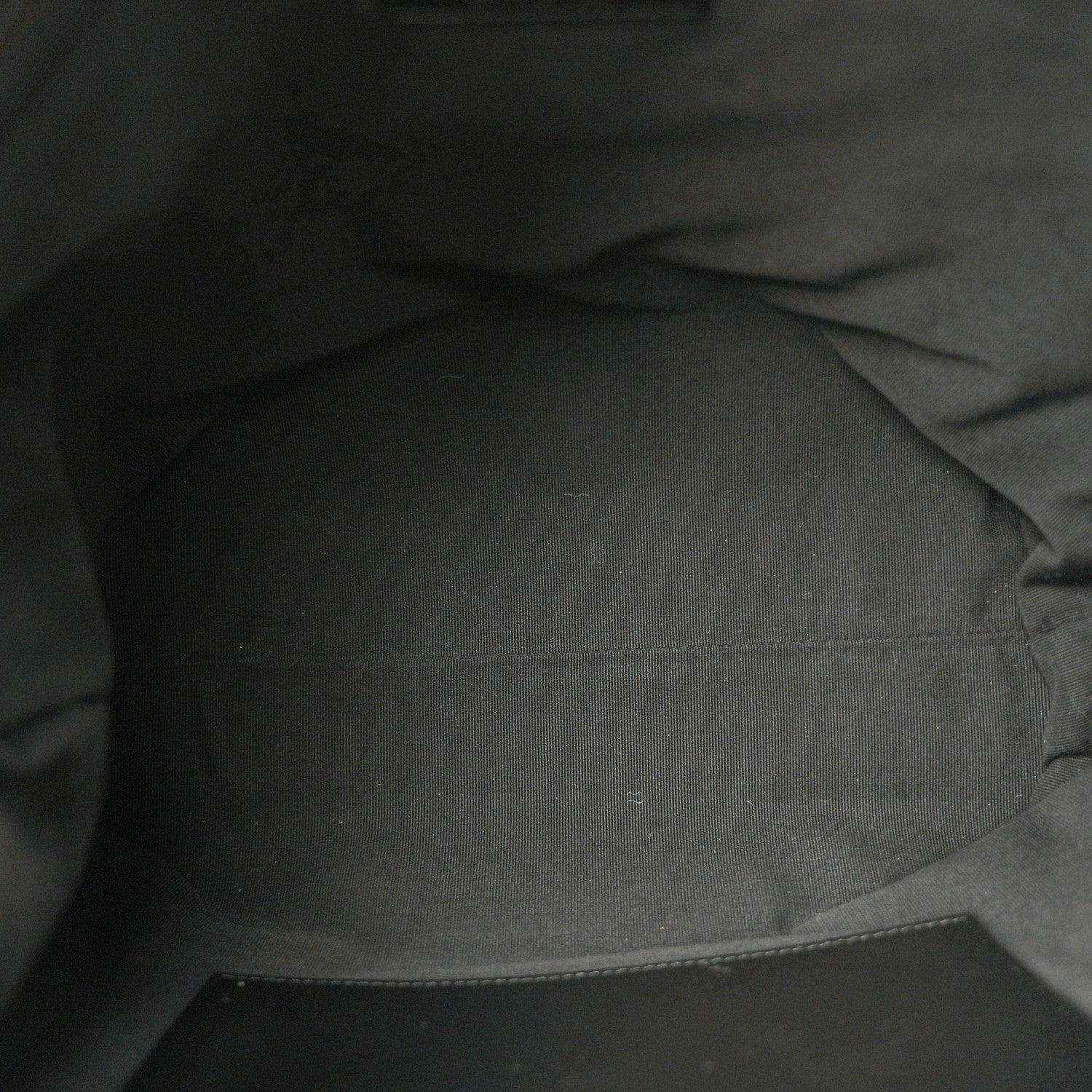 Chanel shopping bag interior lining in dark fabric with stitched seam