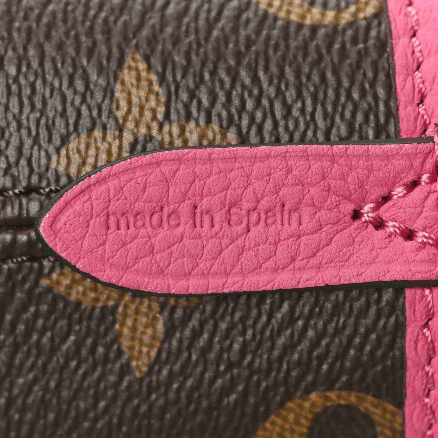 Louis Vuitton monogram inside label on pink leather trim reading 'made in Spain'