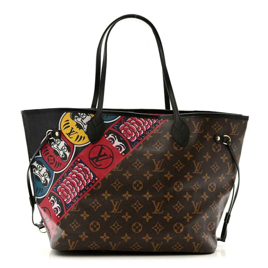 Monogram tote bag with black handles, colorful graphic panels and red/blue accents