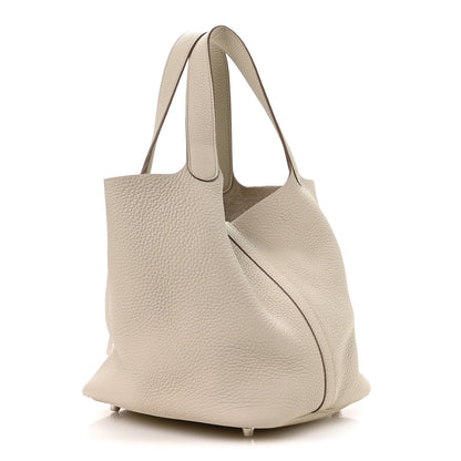 Ivory leather tote bag with slouchy silhouette and side seam