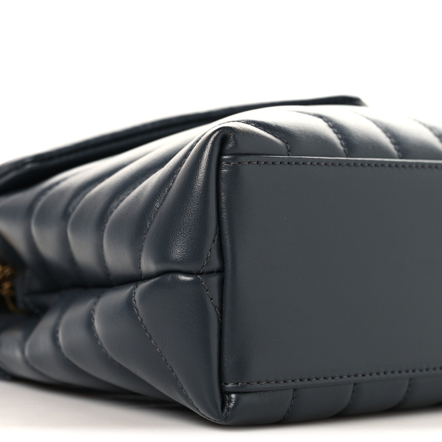 Saint Laurent quilted leather satchel side view with gold chain strap, dark blue