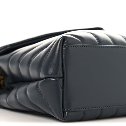 Saint Laurent quilted leather satchel side view with gold chain strap, dark blue