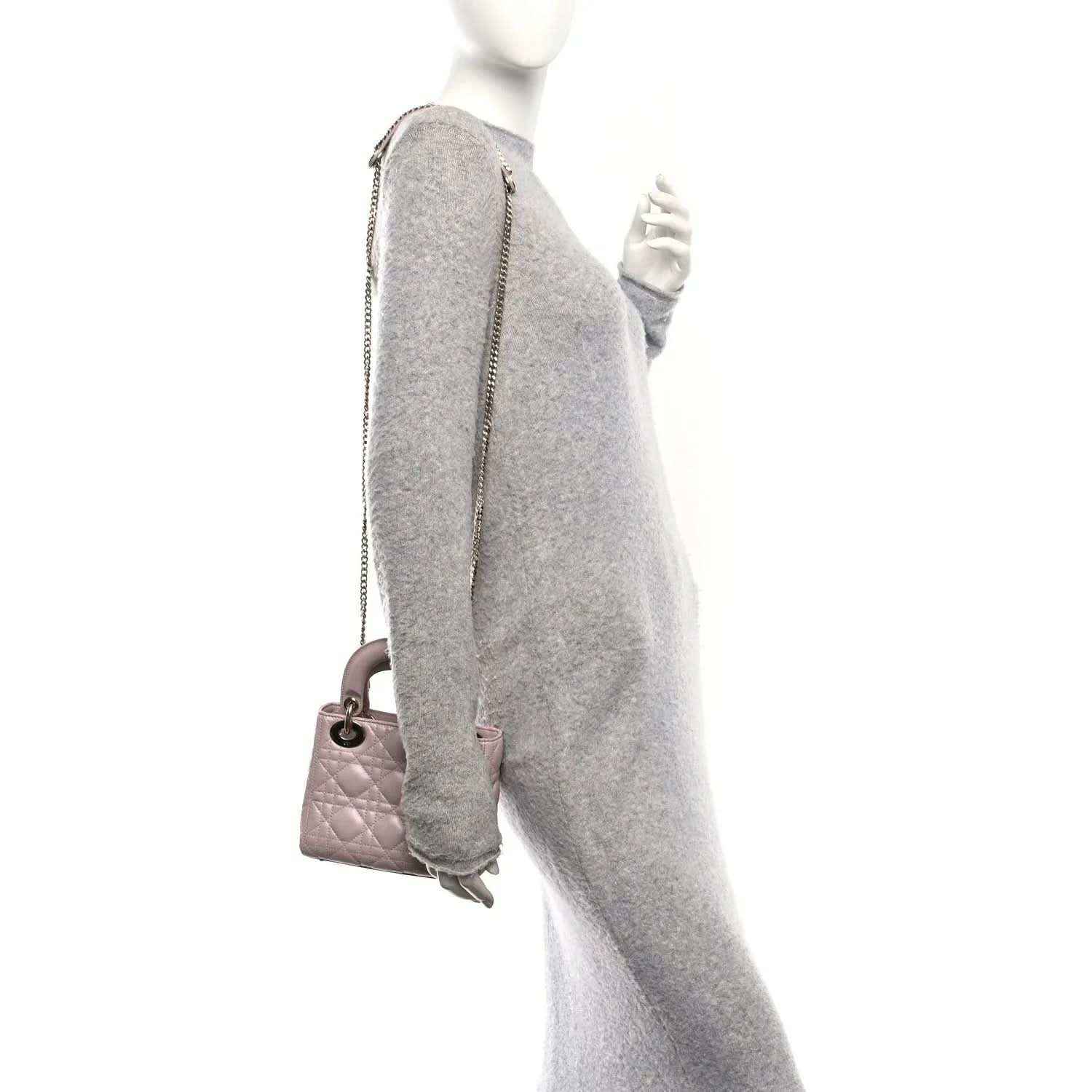 Mini Lady Dior handbag in rose pink lambskin, shown from the side with shoulder strap