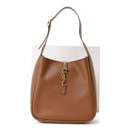 Tan smooth calfskin hobo bag with curved handle and YSL logo charm