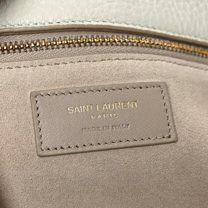 Tote bag interior label with stitched border near the zip opening