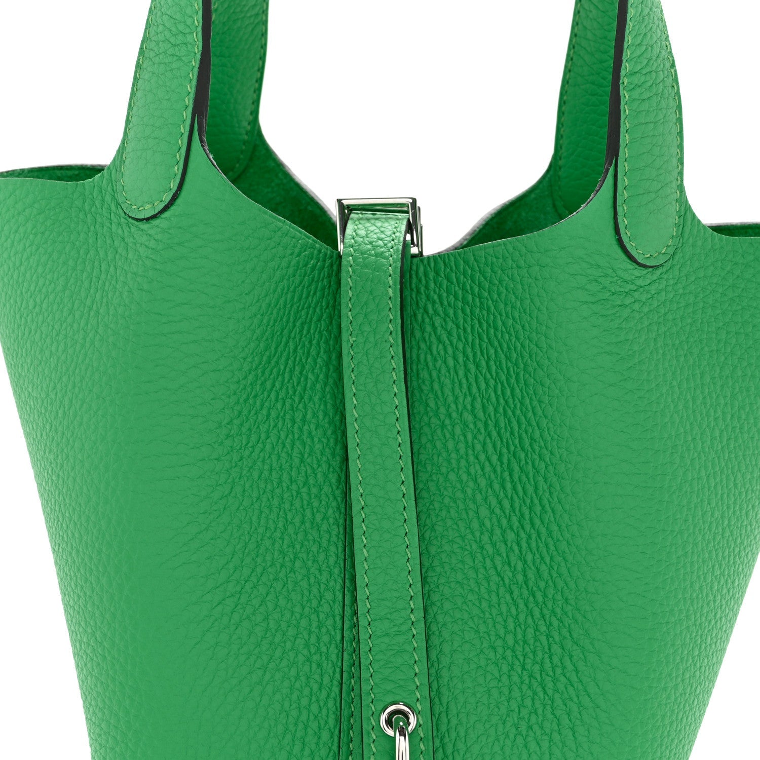 Green leather tote bag with stitched top handles and central zipper lock