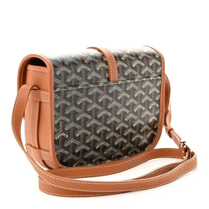 Monogram messenger bag with tan leather top handle, dark patterned body and crossbody strap
