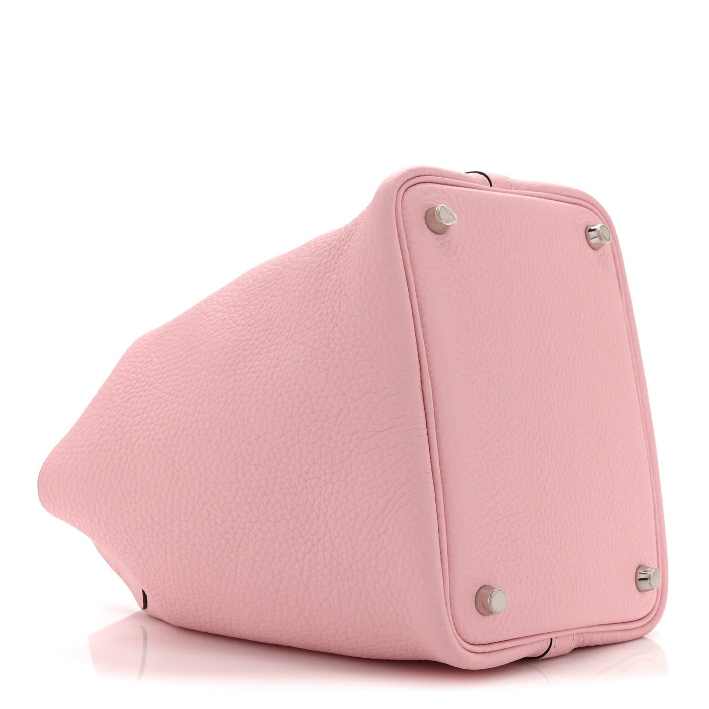 Mauve textured leather handbag with curved shape and metal feet on base