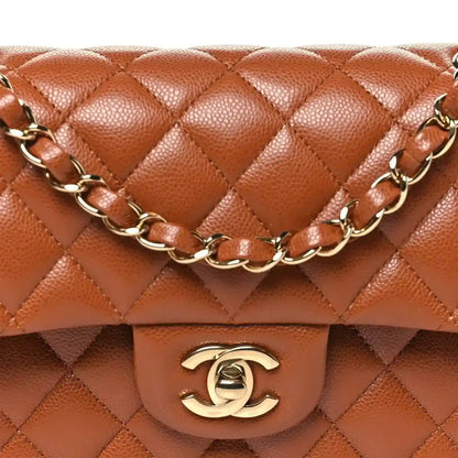 Caramel quilted double flap bag with gold Chanel logo and linked chain