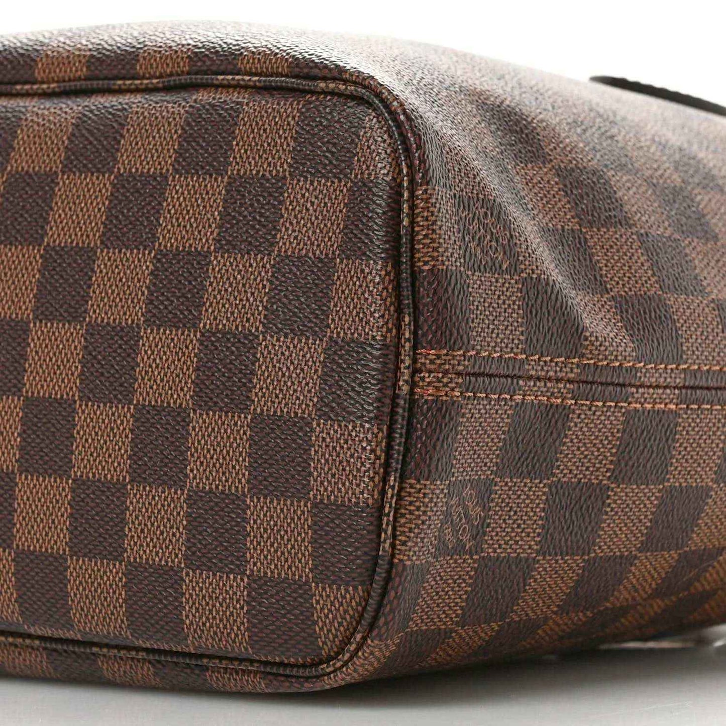 Louis Vuitton Damier Ebene Neverfull PM tote bag close-up of side seam and pocket trim