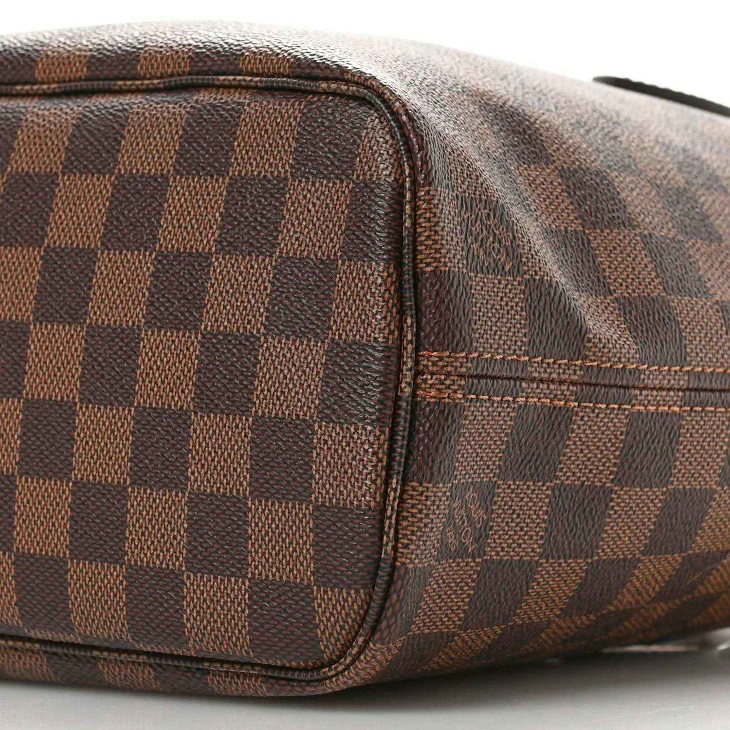 Louis Vuitton Damier Ebene Neverfull PM tote bag close-up of side seam and pocket trim