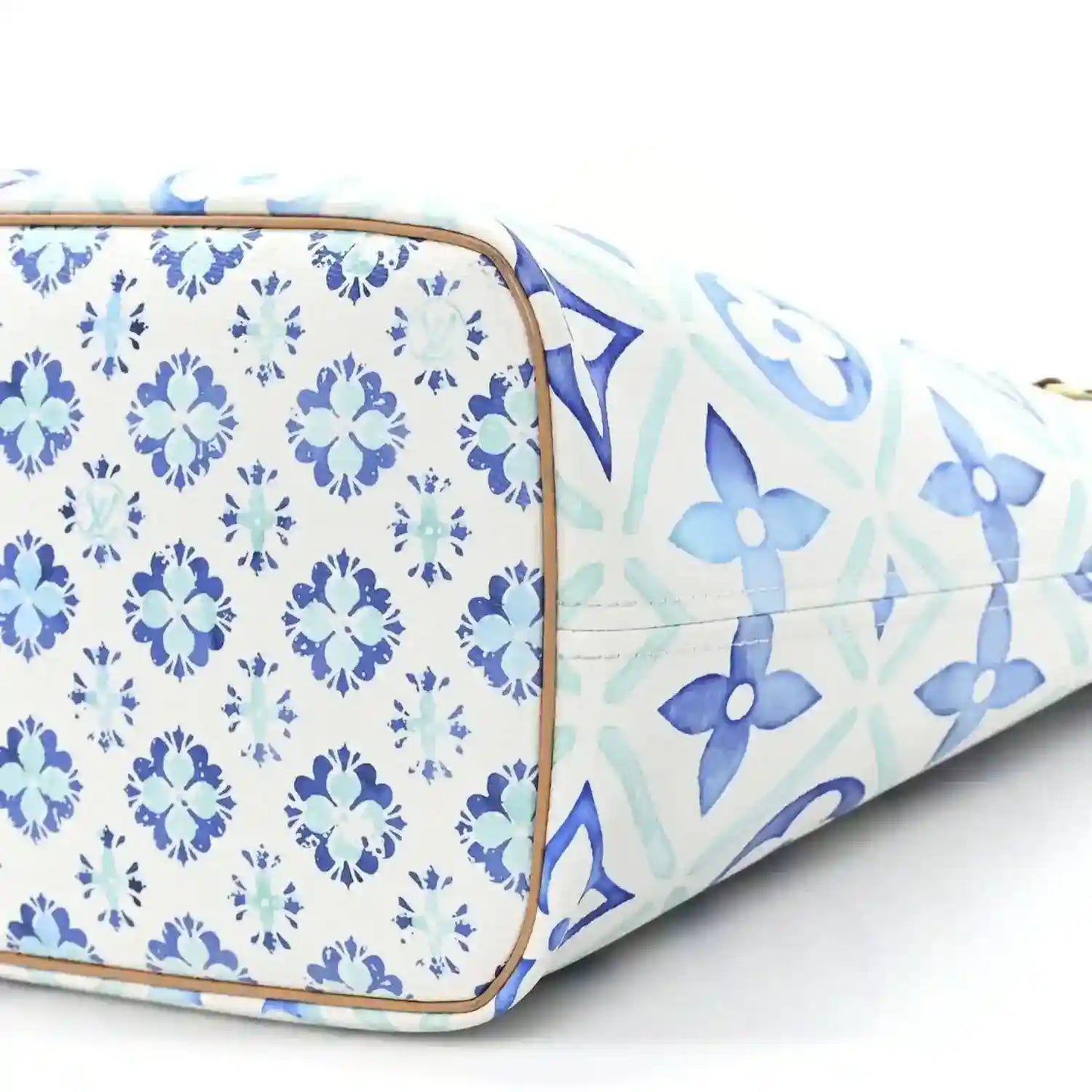 Louis Vuitton Neverfull blue patterned side panel with tan trim at the corner