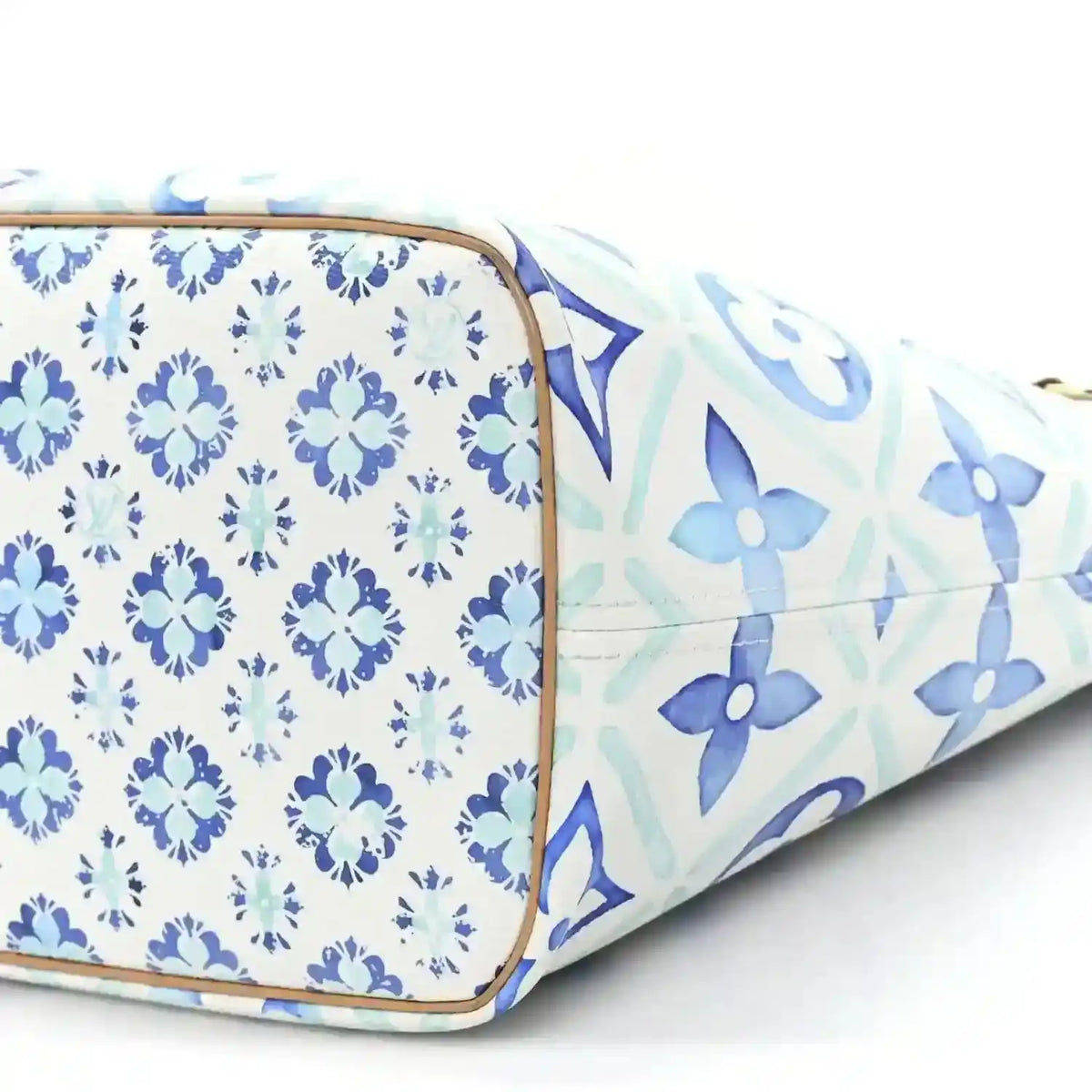 Louis Vuitton Neverfull blue patterned side panel with tan trim at the corner