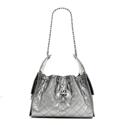 Chanel metallic caviar quilted small handbag with silver chain strap and drawstring closure