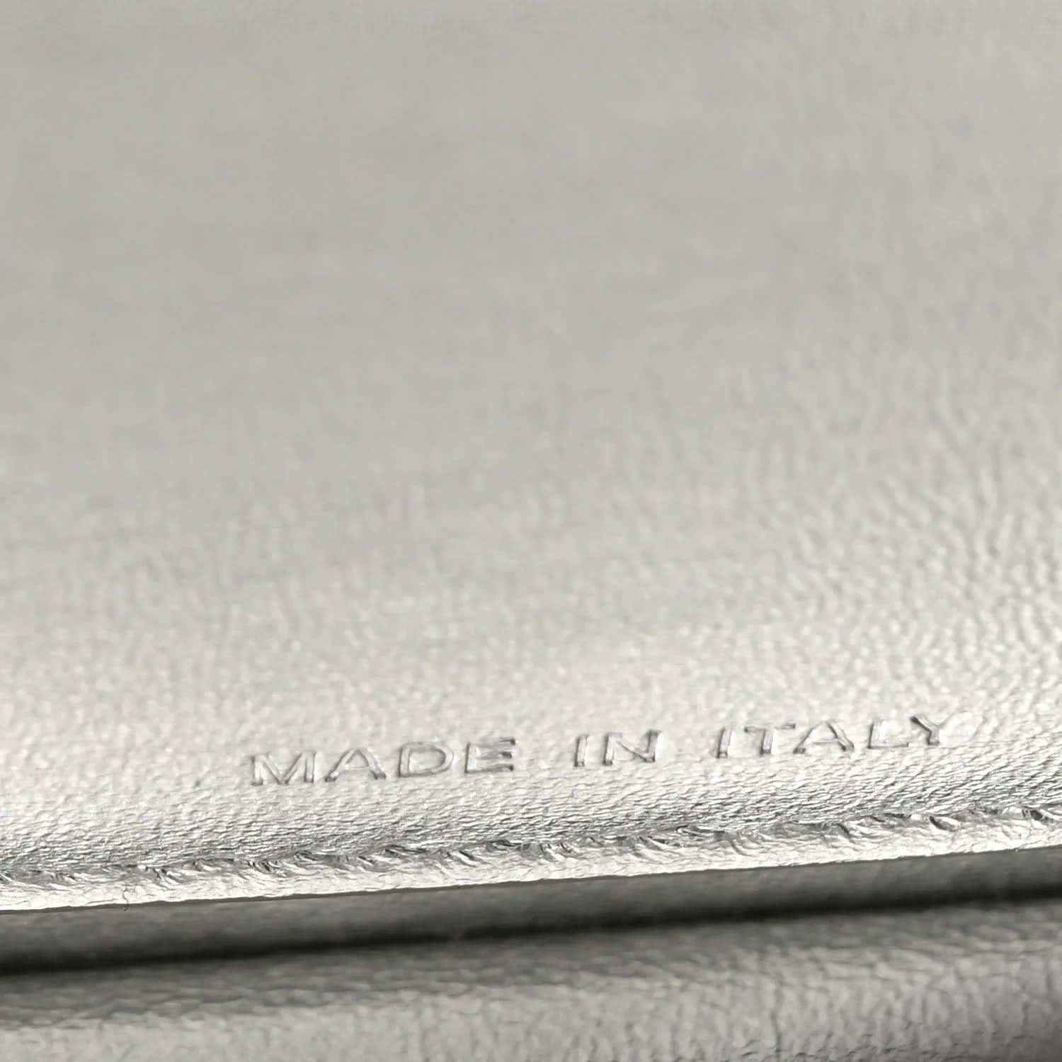 “MADE IN ITALY” embossing on interior leather lining, with stitched edge.