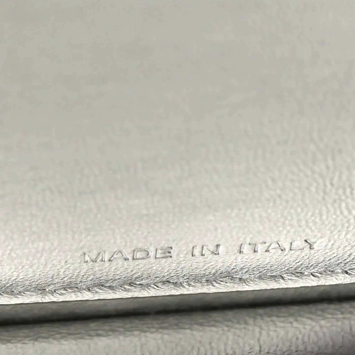 “MADE IN ITALY” embossing on interior leather lining, with stitched edge.