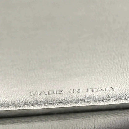 “MADE IN ITALY” embossing on interior leather lining, with stitched edge.