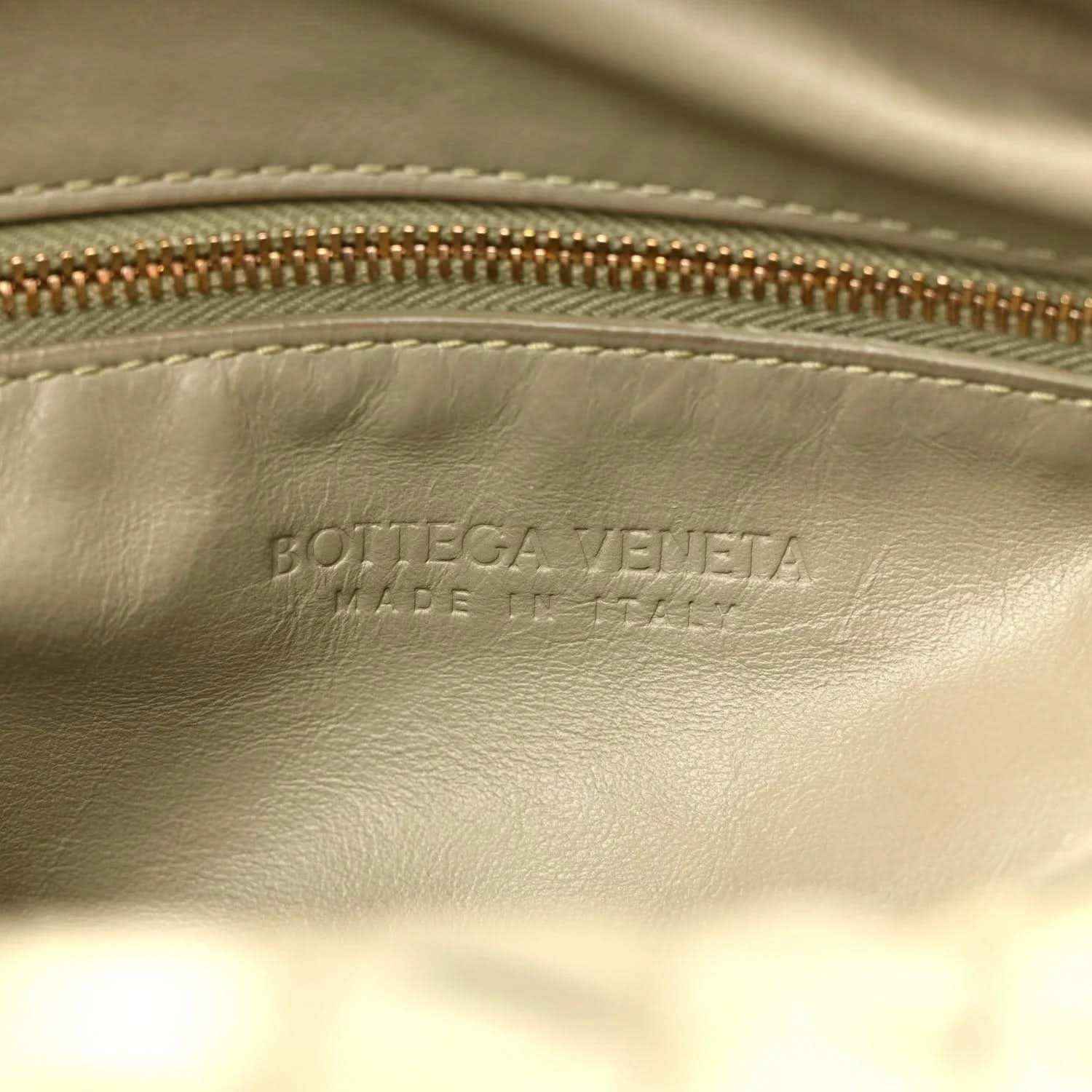 Bottega Veneta logo stamp on leather interior with zipper edge