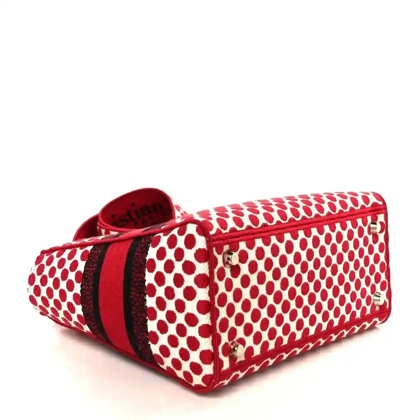 Red and white polka dot canvas tote with top zip and black striped center band