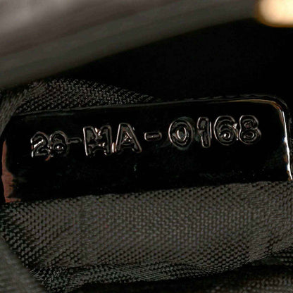 Black fabric lining with stitched label inside mini Lady Dior handbag