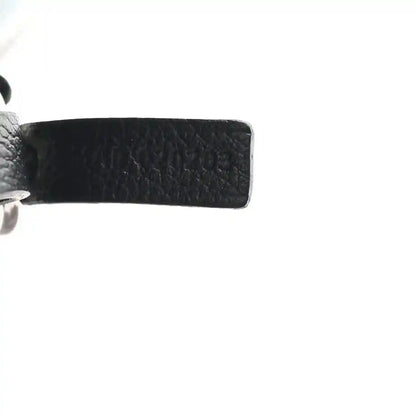 Tote bag strap base with stitched leather edge and metal hardware detail