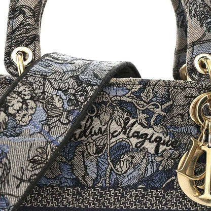 Christian Dior embroidered denim bag front panel with gold Dior charm hardware