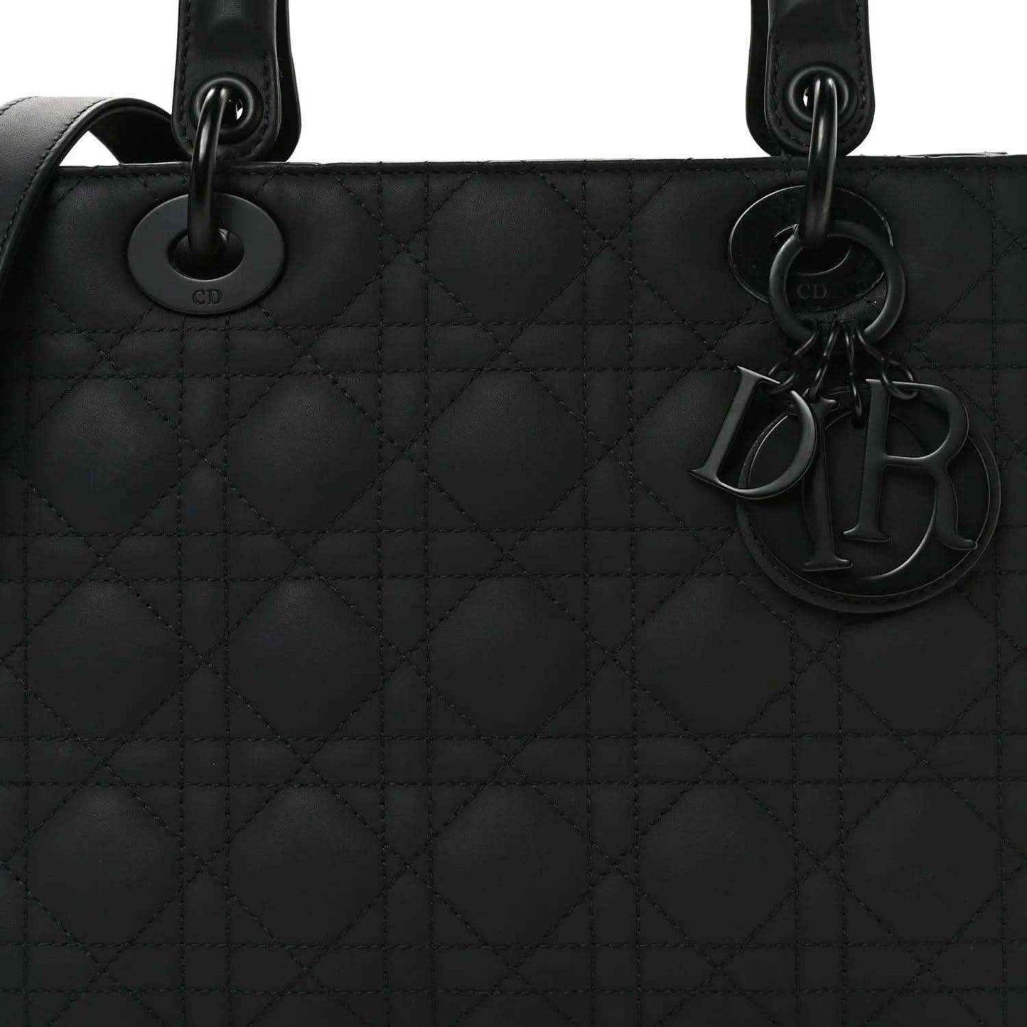 Black Lady Dior handbag front with cannage quilted pattern and Dior charms