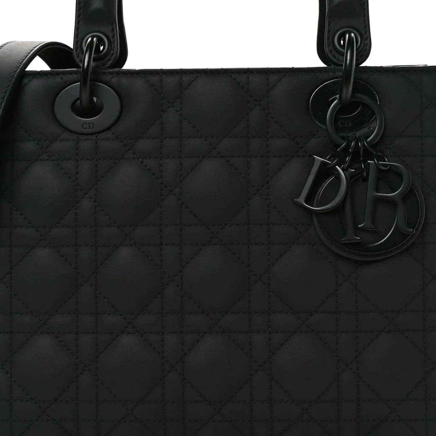 Black Lady Dior handbag front with cannage quilted pattern and Dior charms