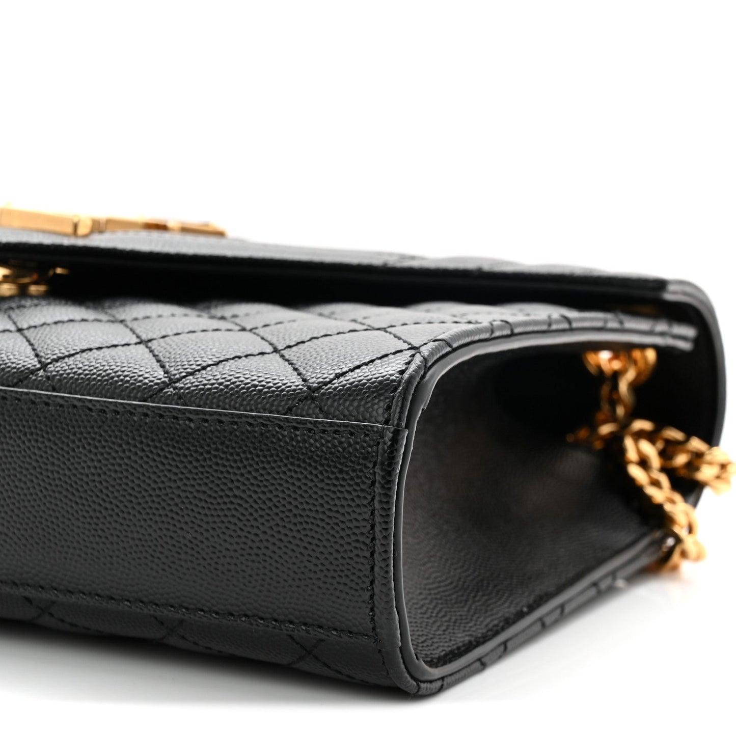 Black quilted satchel bag side view with open top edge and gold chain hardware