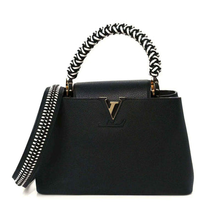 Black leather tote handbag with top handle and braided chain strap