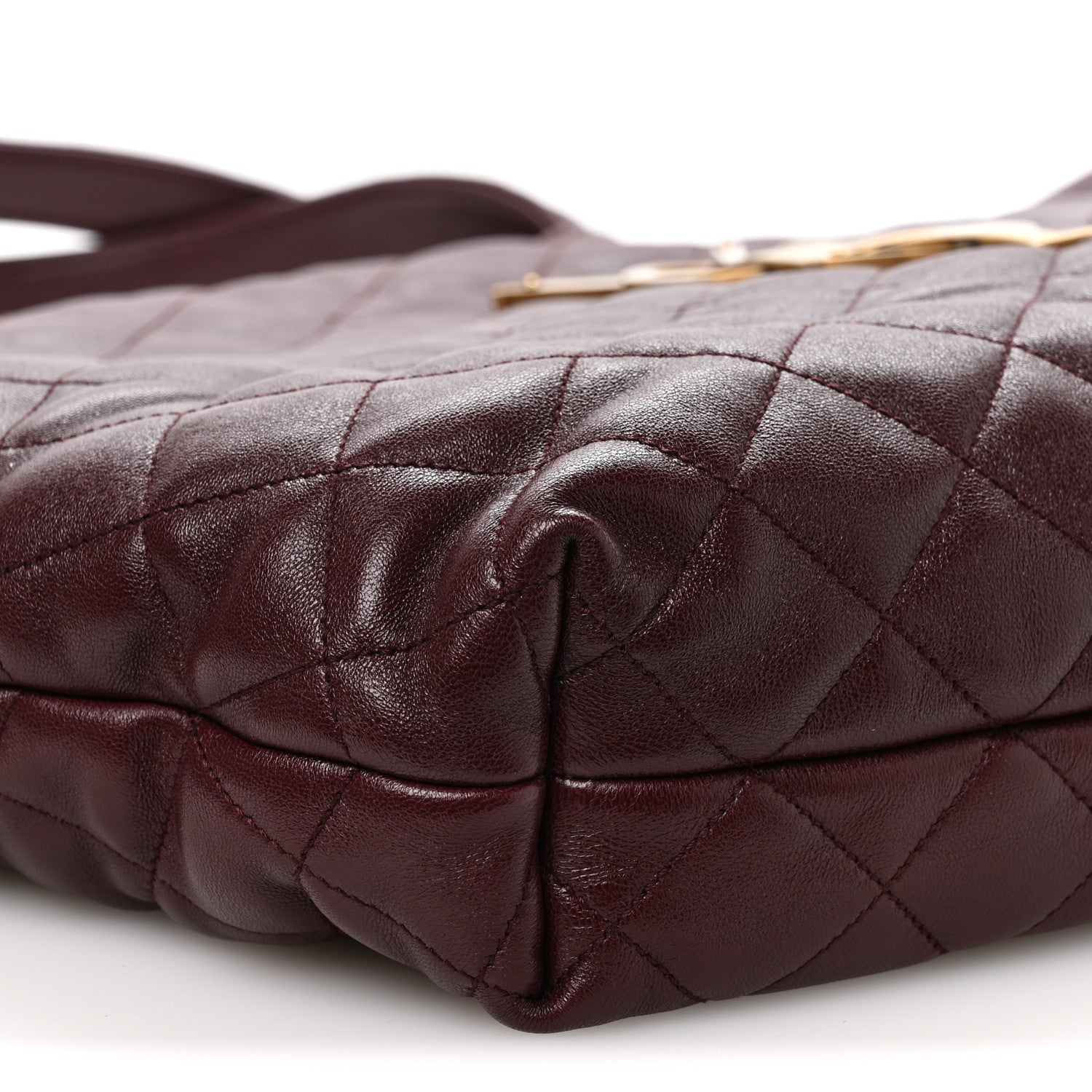 Quilted lambskin tote bottom corner detail with folded leather and stitching