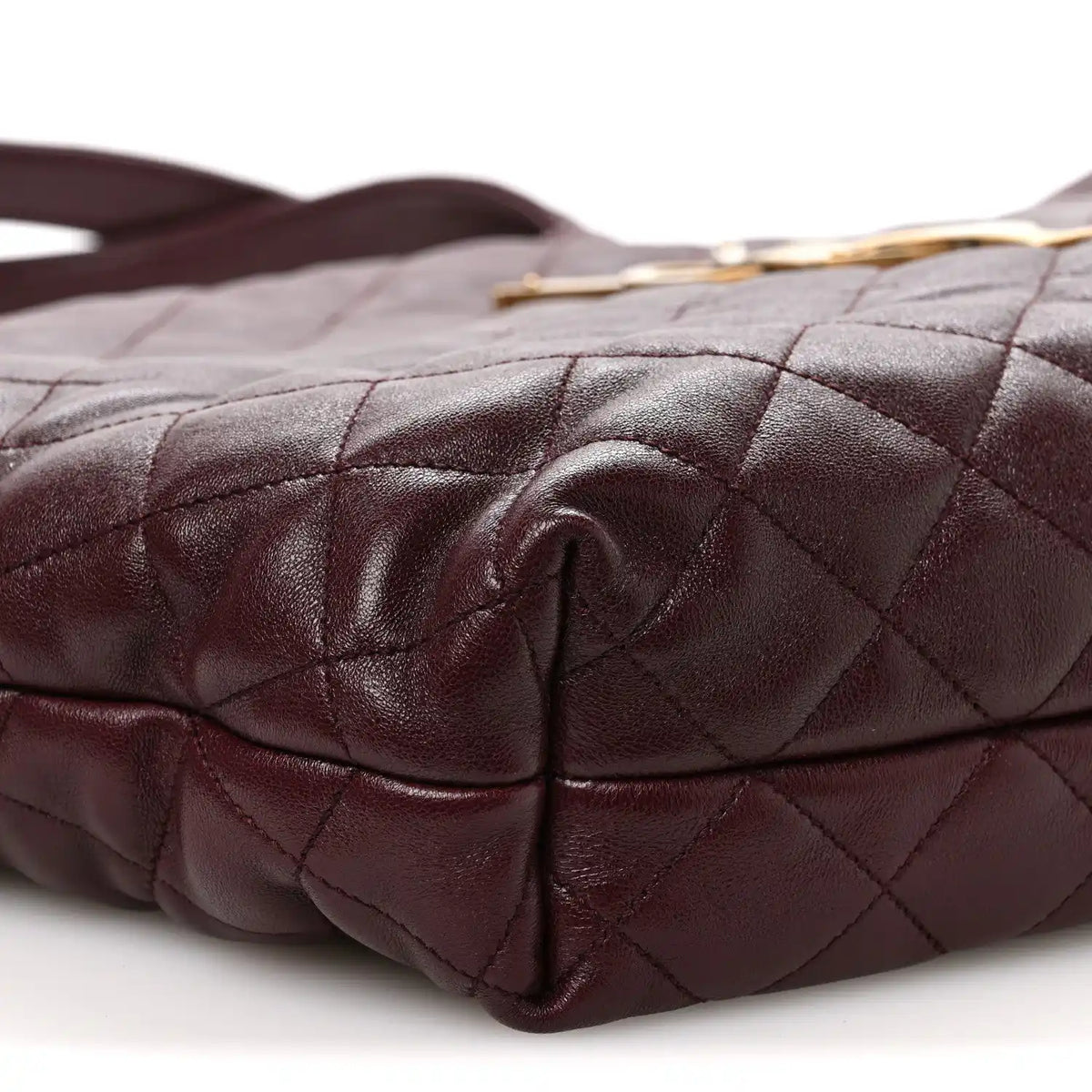 Quilted lambskin tote bottom corner detail with folded leather and stitching