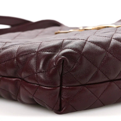 Quilted lambskin tote bottom corner detail with folded leather and stitching